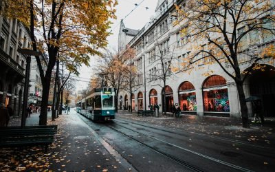 pexels-photo-773471-773471 A tram travels down a leaf-strewn street in autumnal Zürich, Switzerland's urban landscape.